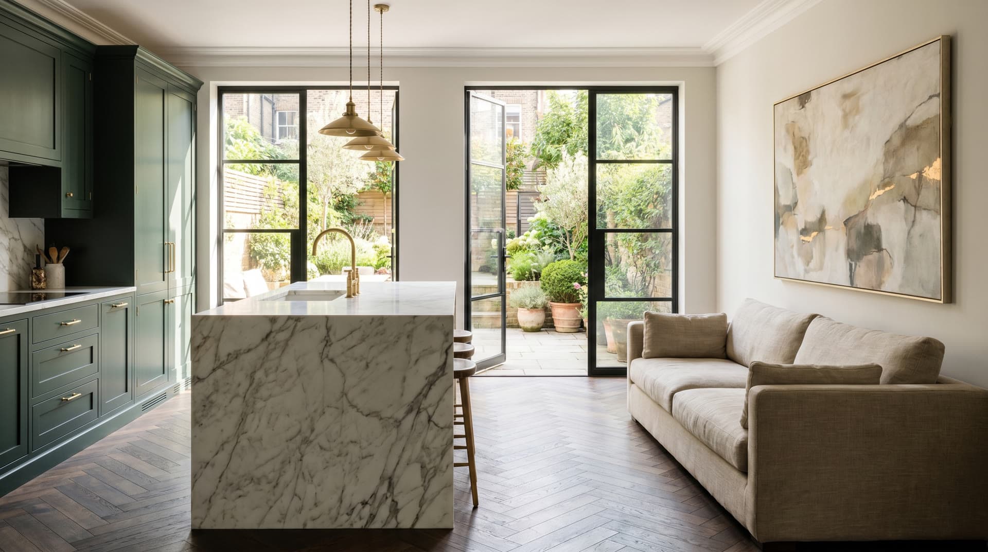 A luxury open-plan kitchen with a marble island and Crittall doors