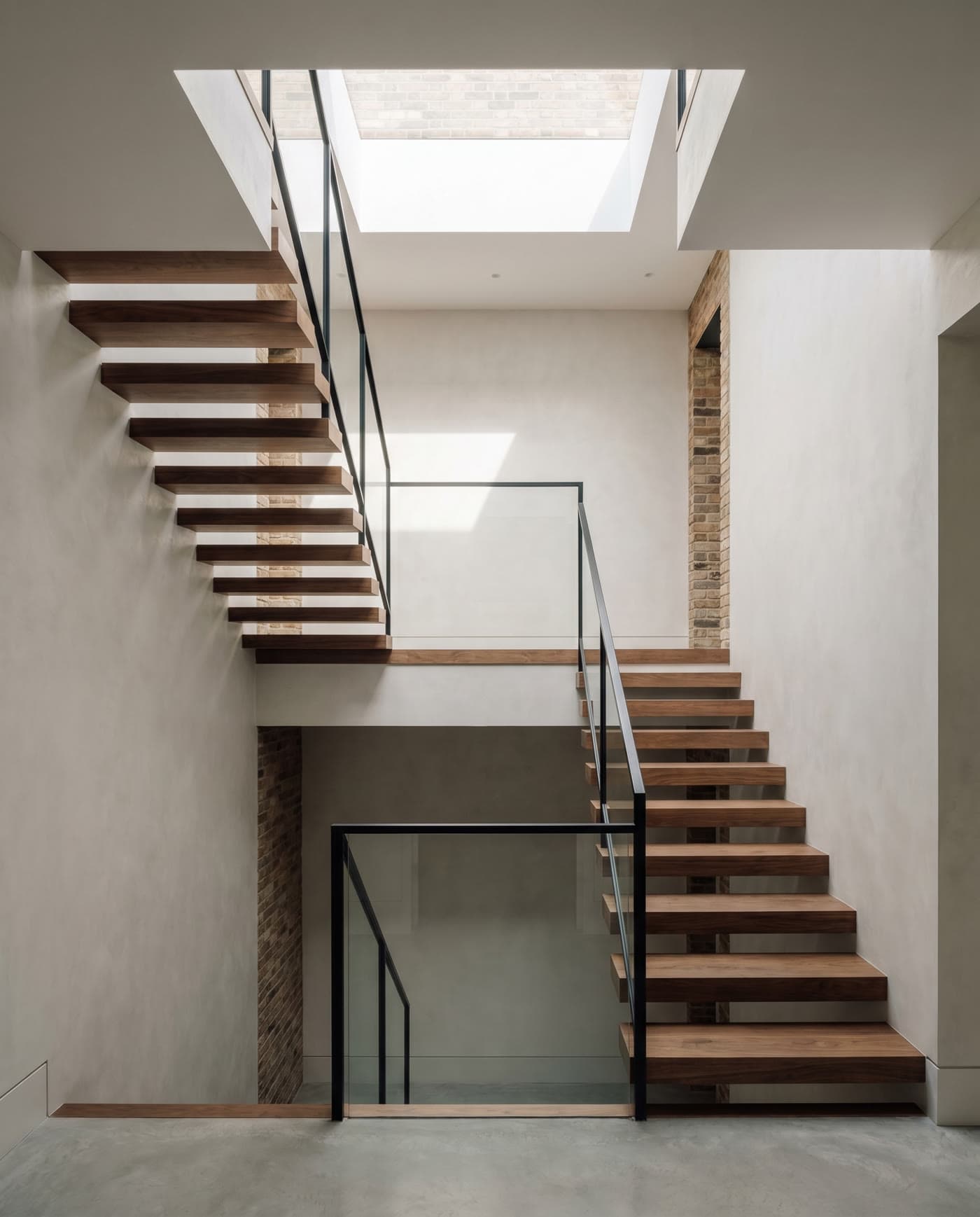 A sculptural staircase in a renovated period home